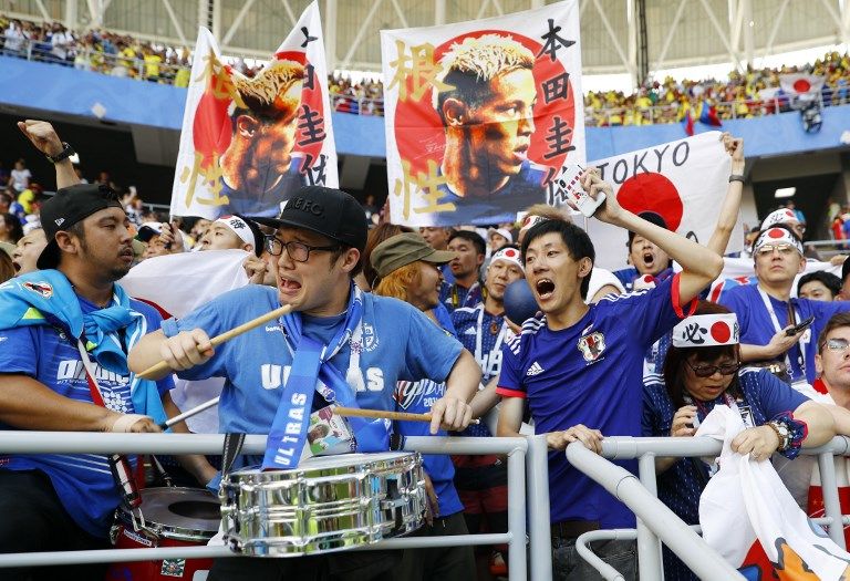 日本拿下首勝，球迷歡欣鼓舞。法新社