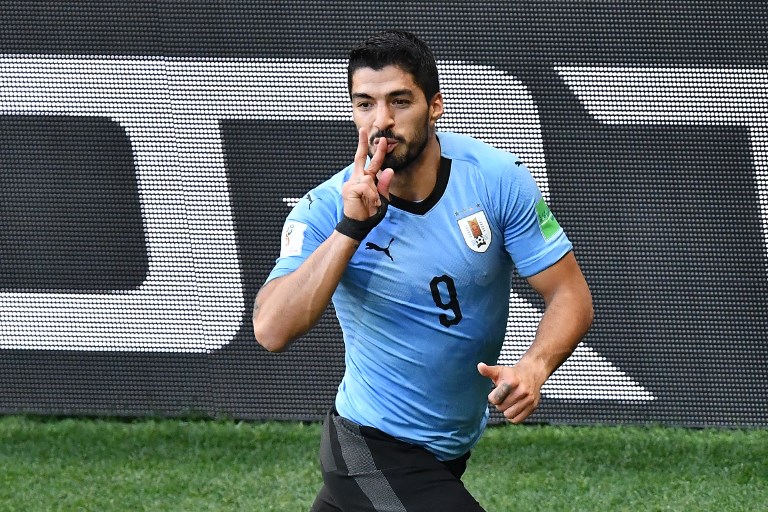 不咬人的蘇亞雷斯更厲害，百場隊中為烏拉圭進球並提前晉級16強。法新社