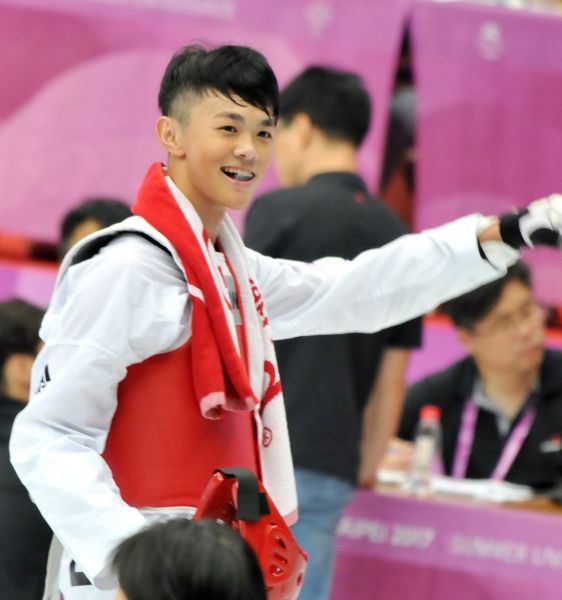 男子跆拳道63-68公斤級中華隊黃鈺仁勝出後露出微笑。圖/2017世大運組委會提供